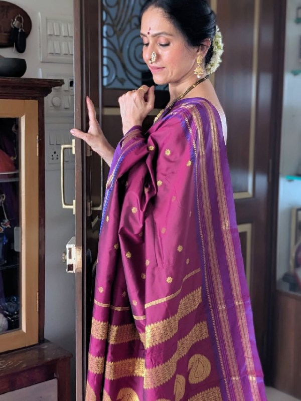 Aishwarya Narkar Shines in Traditional Pink Saree with Floral Bun and Elegant Jewelry