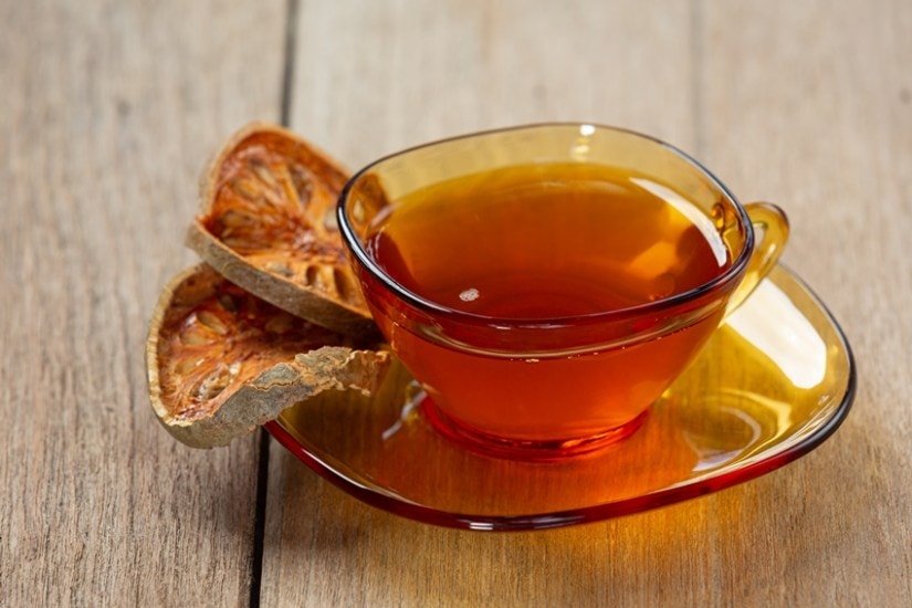 Hot dry bael fruit tea in a Thai herbal cup