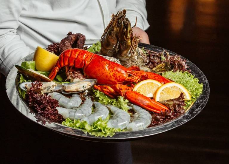 Which country has more consumption of seafood