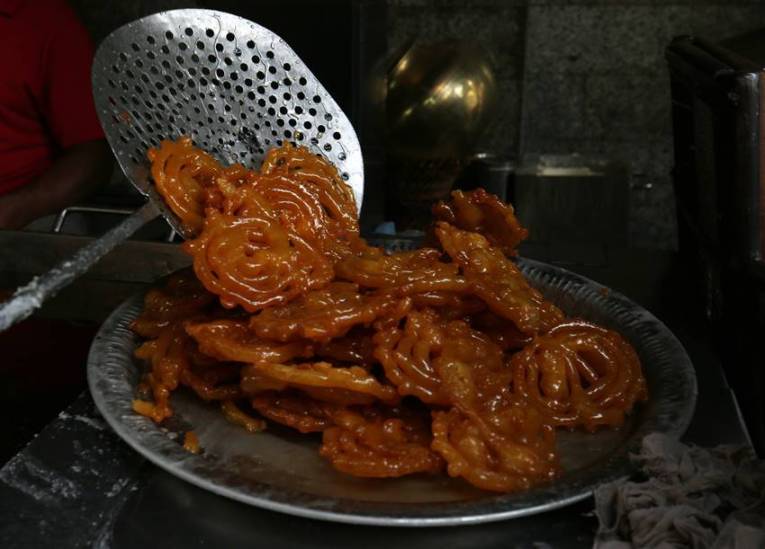 Where do people eat jalebi with fish?