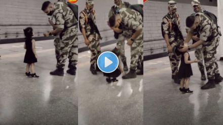 Little girl touching the feet of Indian soldiers showing respect