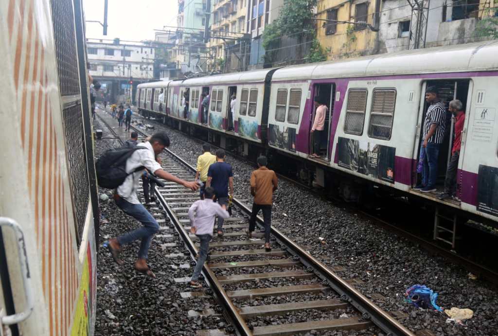 Heavy rains in Mumbai caused panic flooding traffic jams and major Central Railway disruption