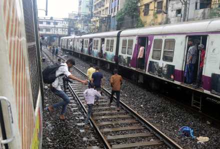 Heavy rains in Mumbai caused panic flooding traffic jams and major Central Railway disruption