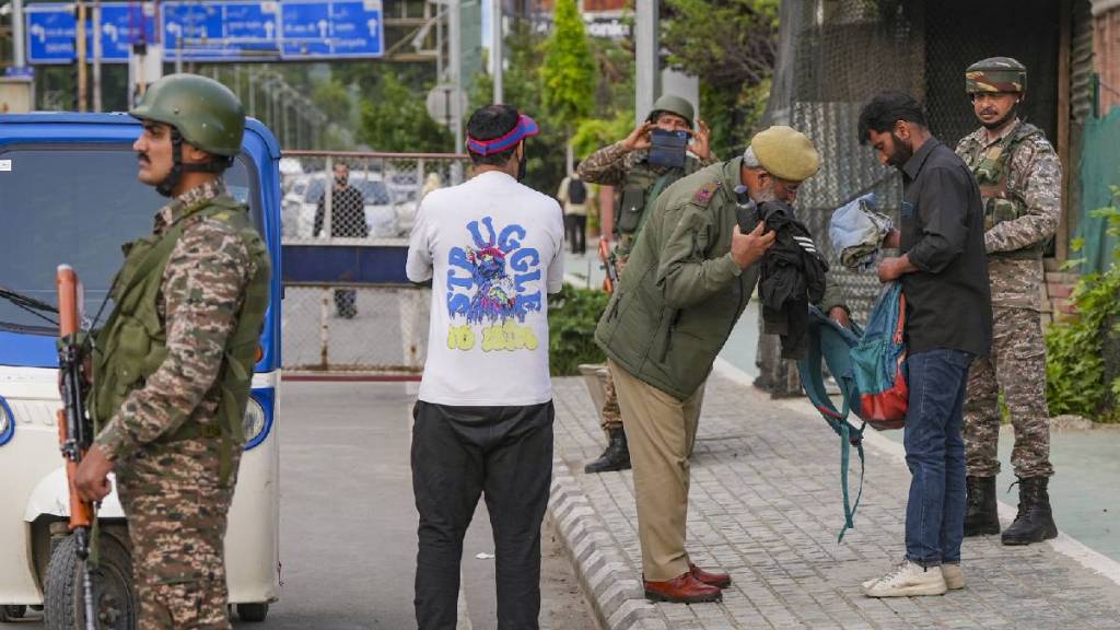 Security personnel patrol along the Dal Lake