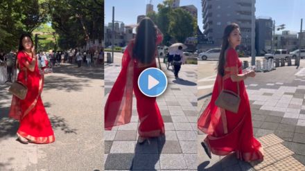 Indian girl wearing saree walking on a street in Japan