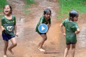 small girl dances in rain