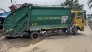 Virar virar municipal corporation garbage truck stuck in pothole traffic jam
