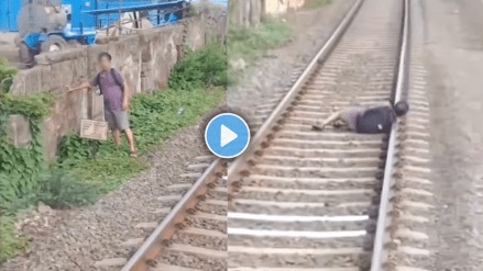 Shocking video of man sleeps on railway track motorman saves his life viral video on social media