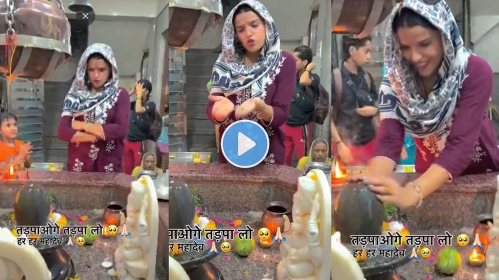 a woman making reel in front of shivling in temple