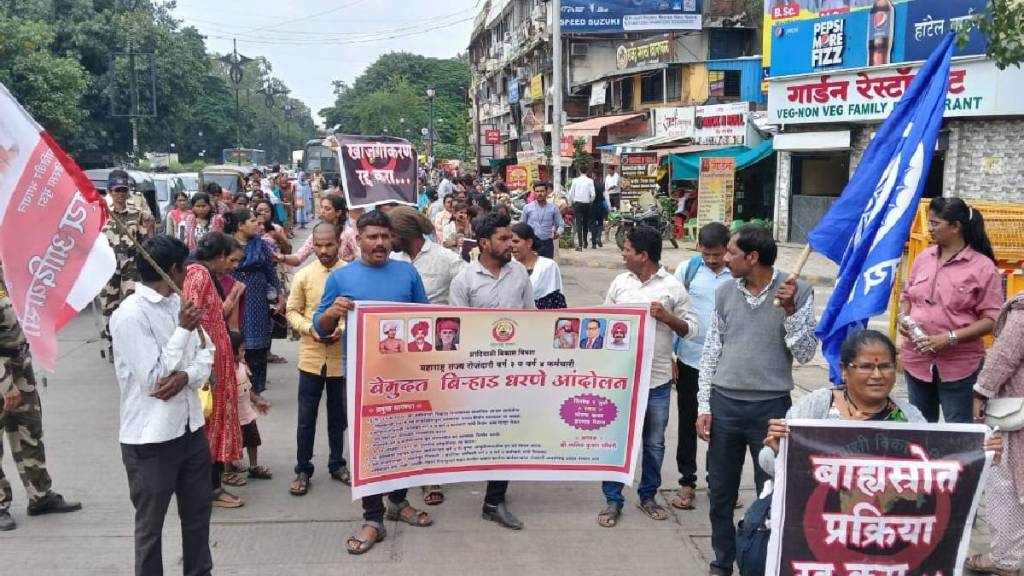 Daily wage earners protest in front of the Tribal Development Building