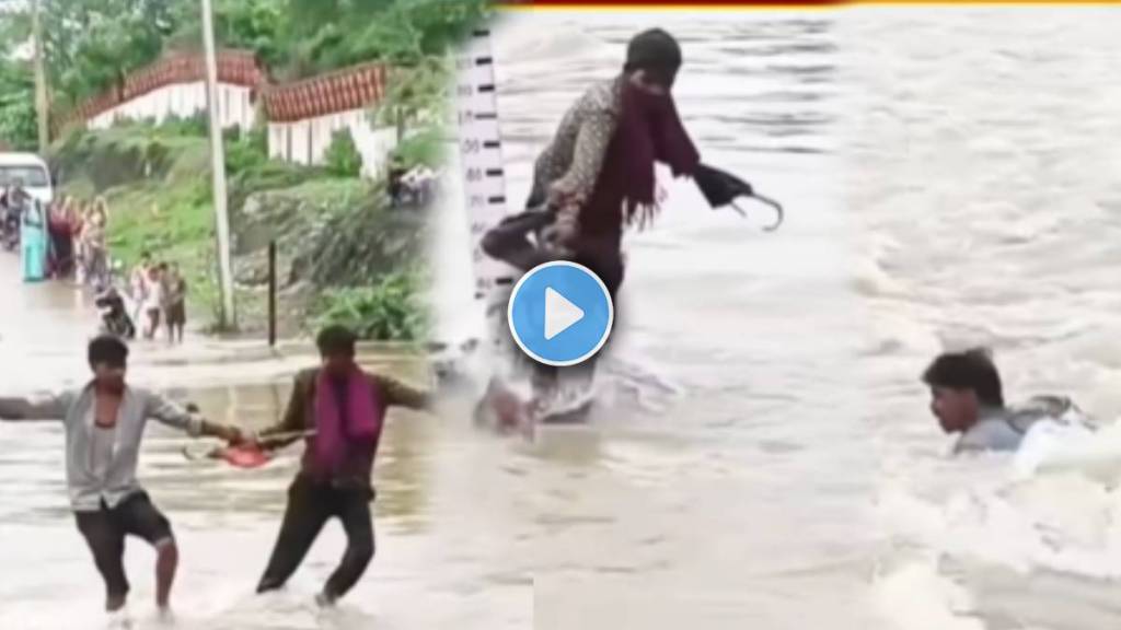 two boys wade into flood waters