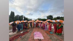 Shiv Sena eknath Shinde faction distributing umbrellas with photograph of eknath Shinde