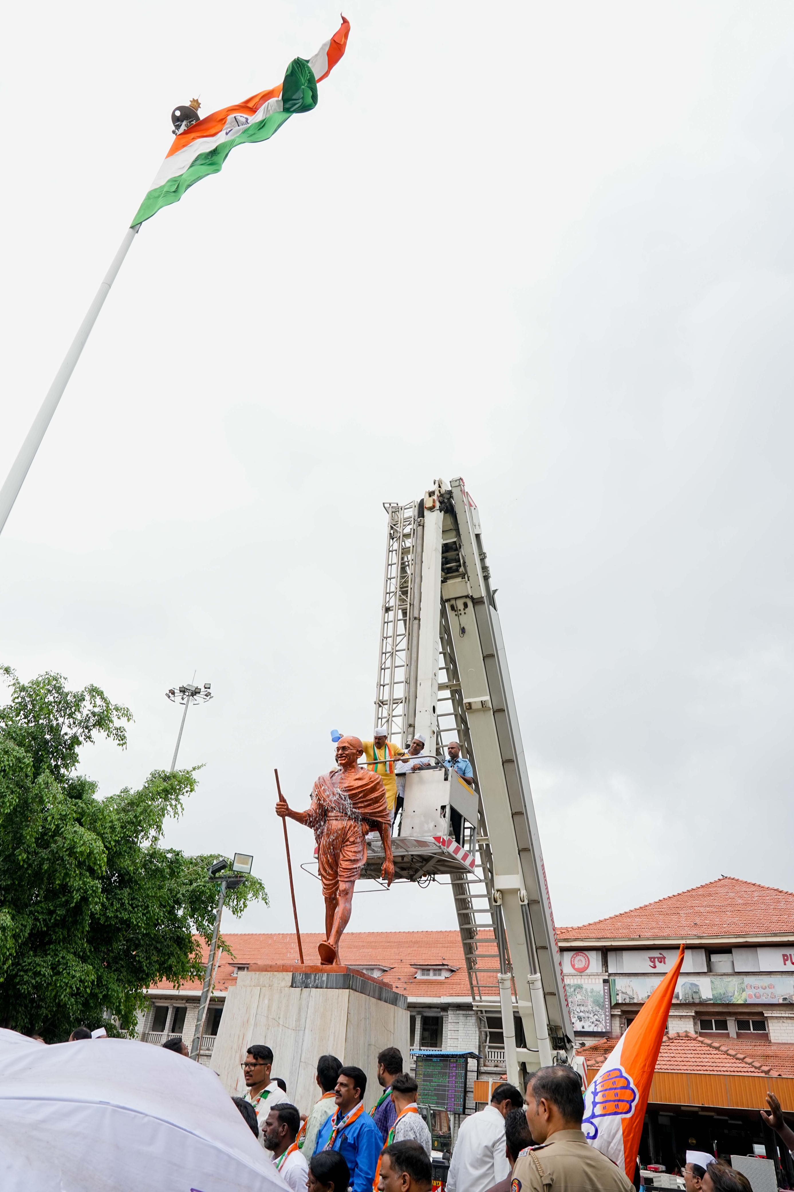 Pune city congress washed the Gandhi statue with milk at Pune railway station during a protest on Monday. A person identified as Suraj Shukla vandalized the statue on Sunday