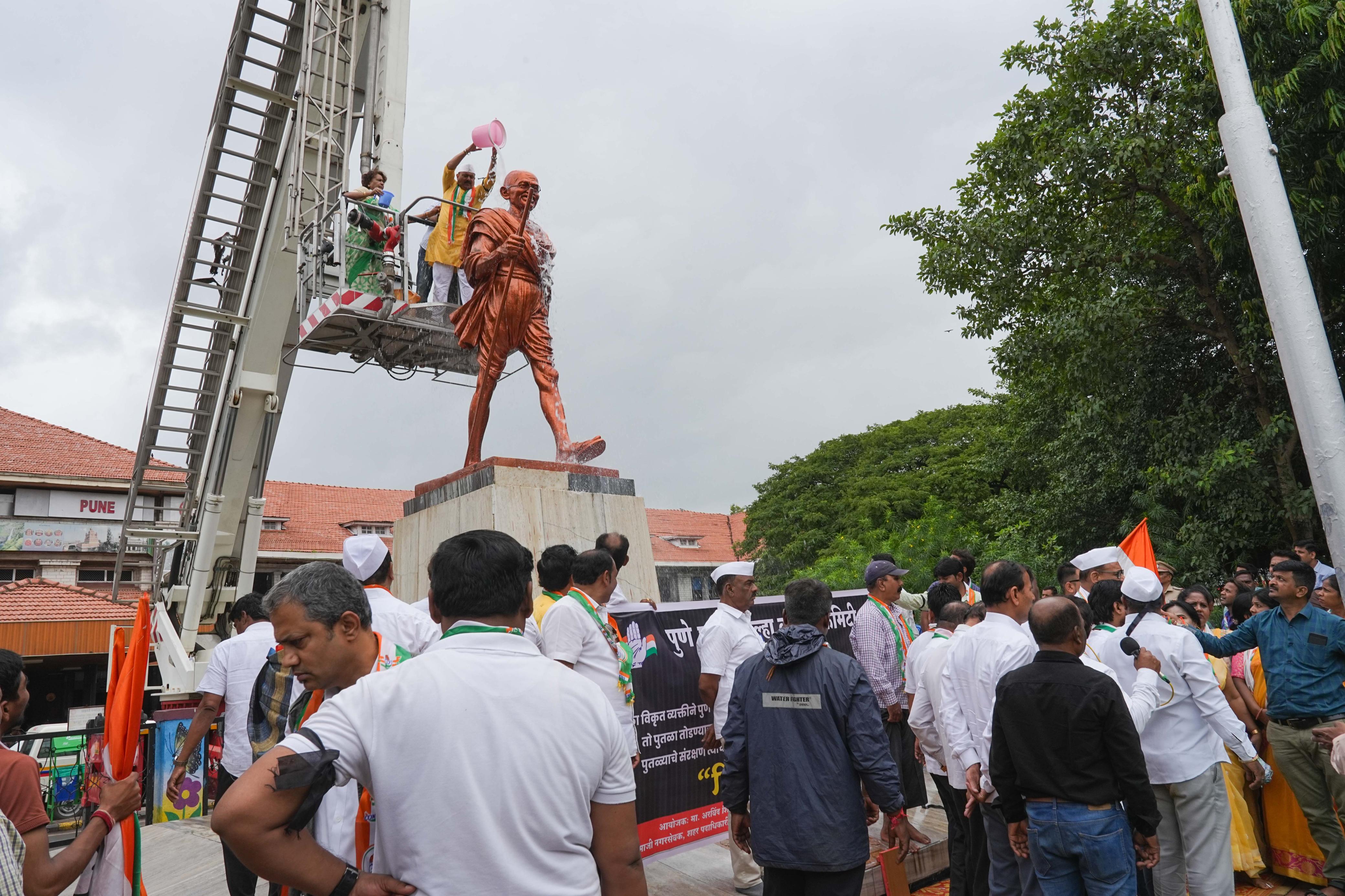 Pune city congress washed the Gandhi statue with milk at Pune railway station during a protest on Monday. A person identified as Suraj Shukla vandalized the statue on Sunday