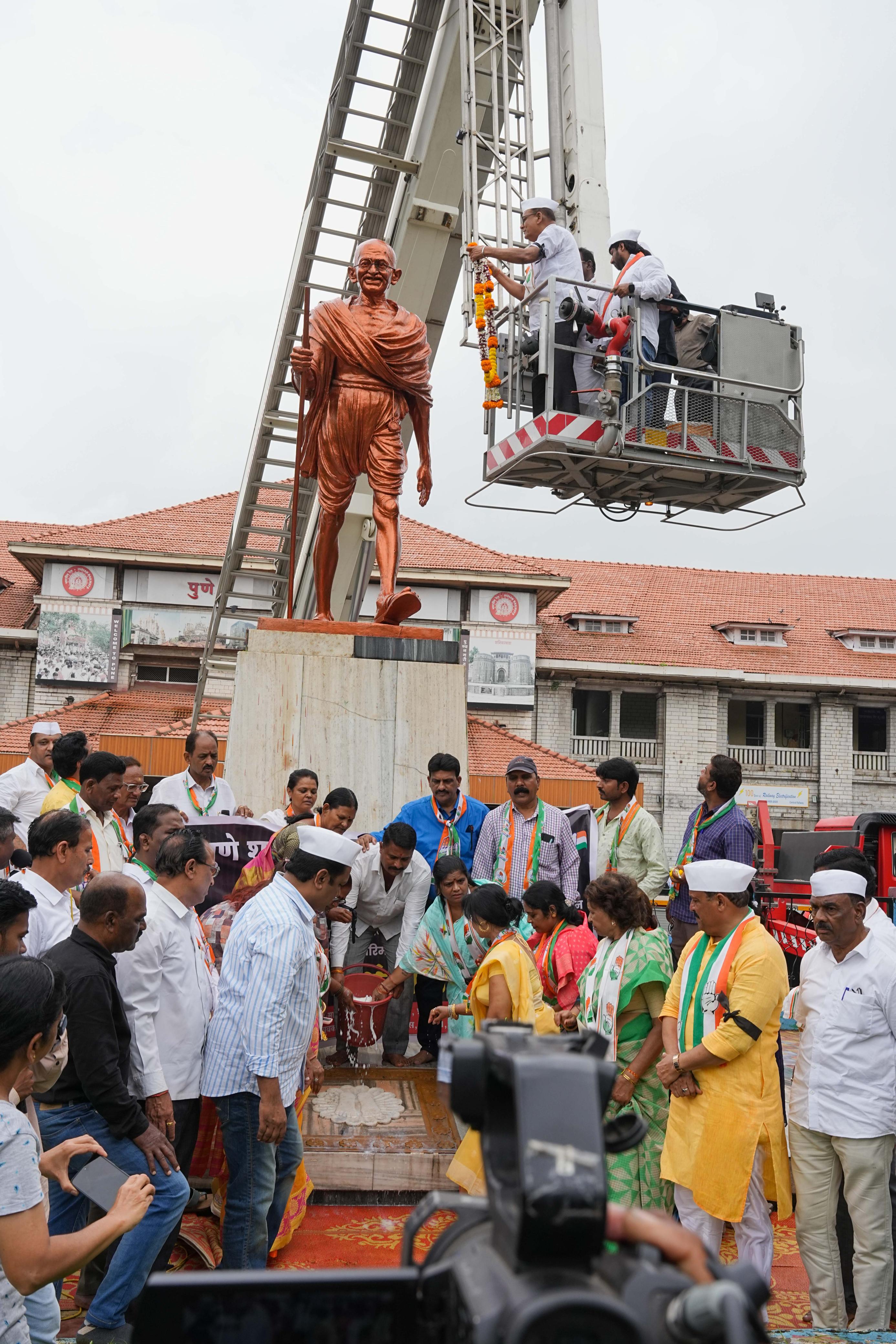 Pune city congress washed the Gandhi statue with milk at Pune railway station during a protest on Monday. A person identified as Suraj Shukla vandalized the statue on Sunday