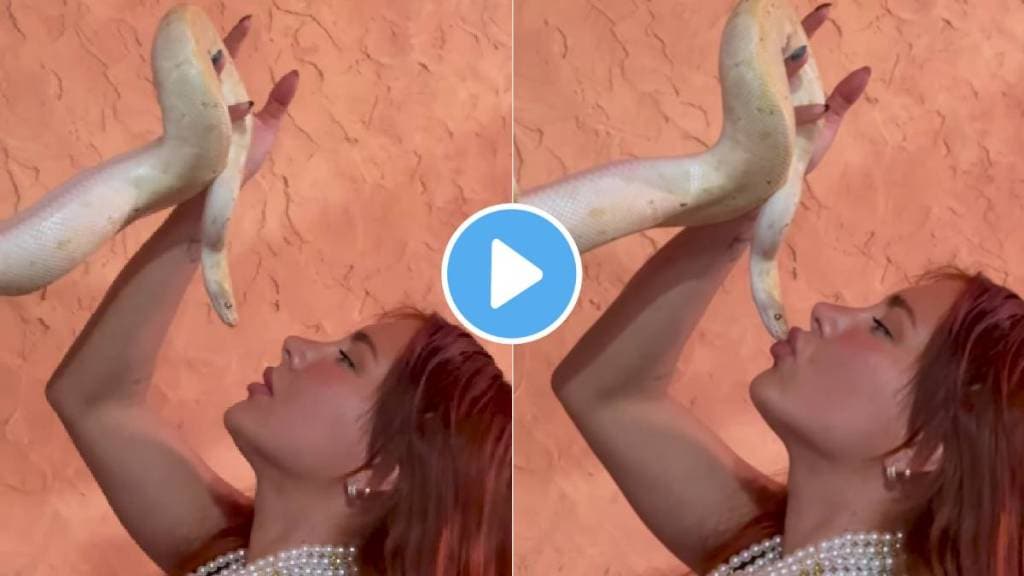 Viral video woman kissing snake