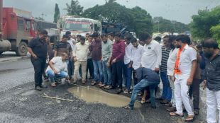 ghodbunder road crisis mns leader avinash Jadhav measures pothole depths questions ministers