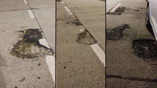 Potholes on the road in front of the Express Tower and the five-star Trident Hotel in the Nariman Point area