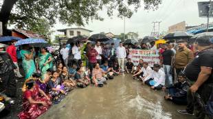 Dighode villagers protest by sitting in a pit