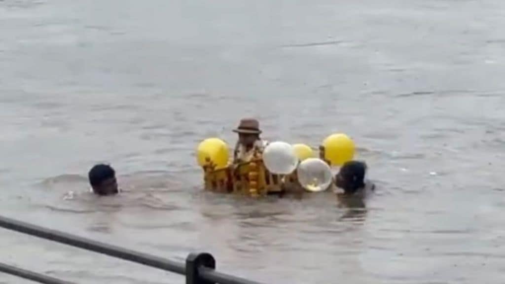 A child carried in a cradle   unique ritual in flood-hit Krishna river for vow fulfillment in Sangli