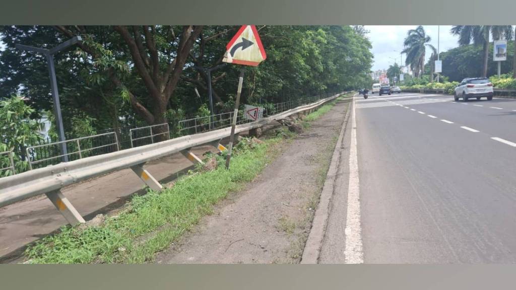 damaged Palm bach road barriers obstruct