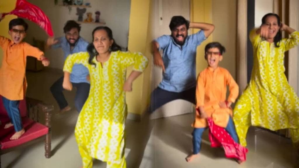 husband, wife and son dance together