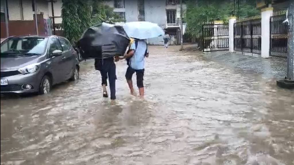 roads and parking lots under buildings in Sector r 1 and 2 of Pushpak Wadghar node in Karanjade Panvel submerged in water