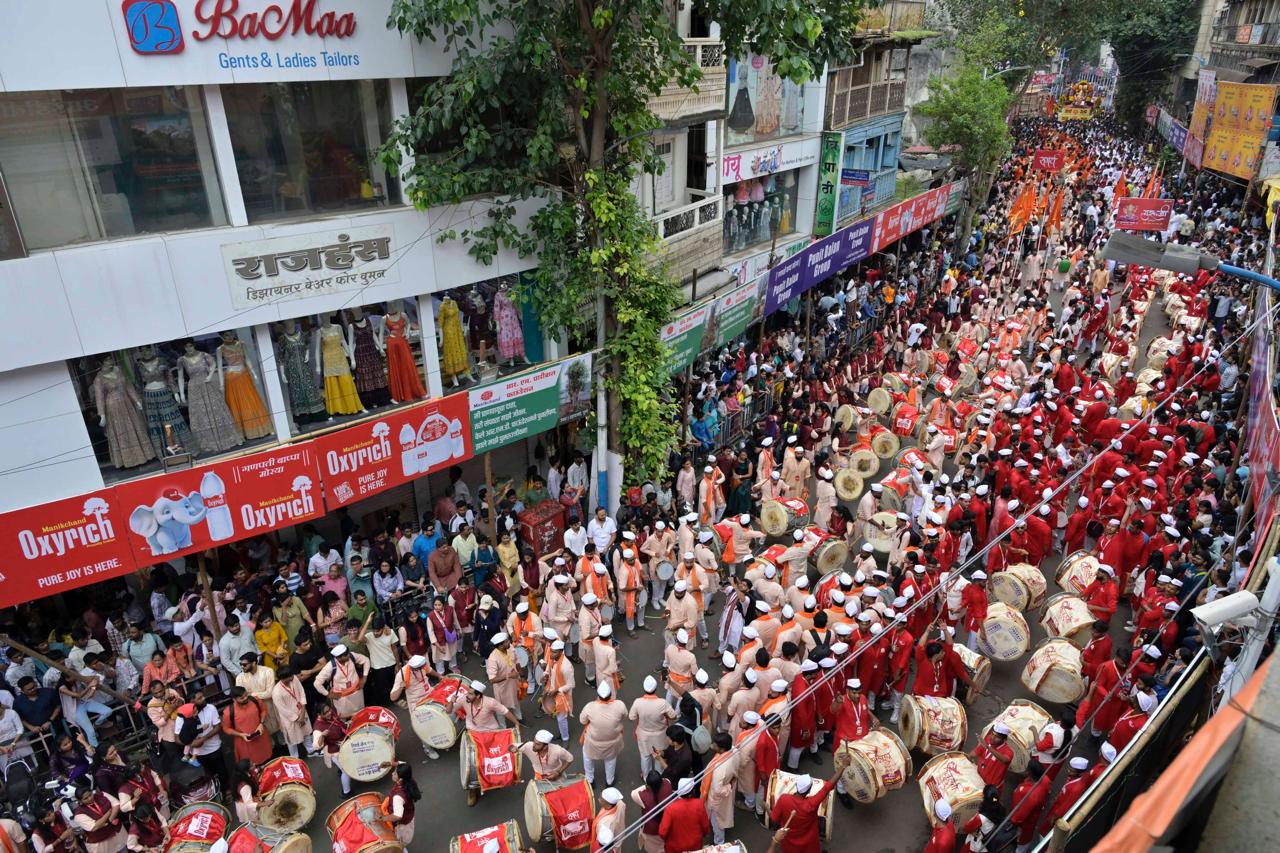 On the occasion of Ganesh Chaturthi today, the processions of the city's Manache Ganpati and other Ganesh mandals, took place with great enthusiasm and vibrancy, accompanied by the beats of dhols and tashas, along Laxmi Road