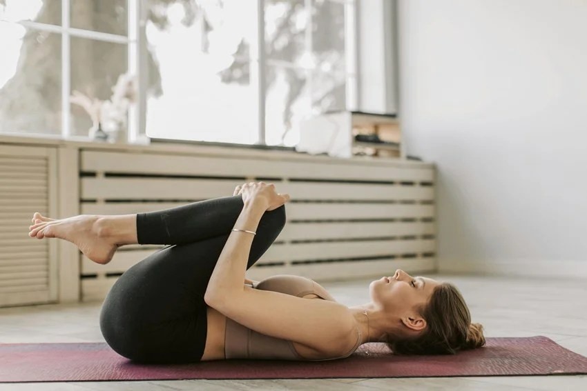 Pavanamuktasana benefits, yoga for stomach issues, easy yoga for digestion