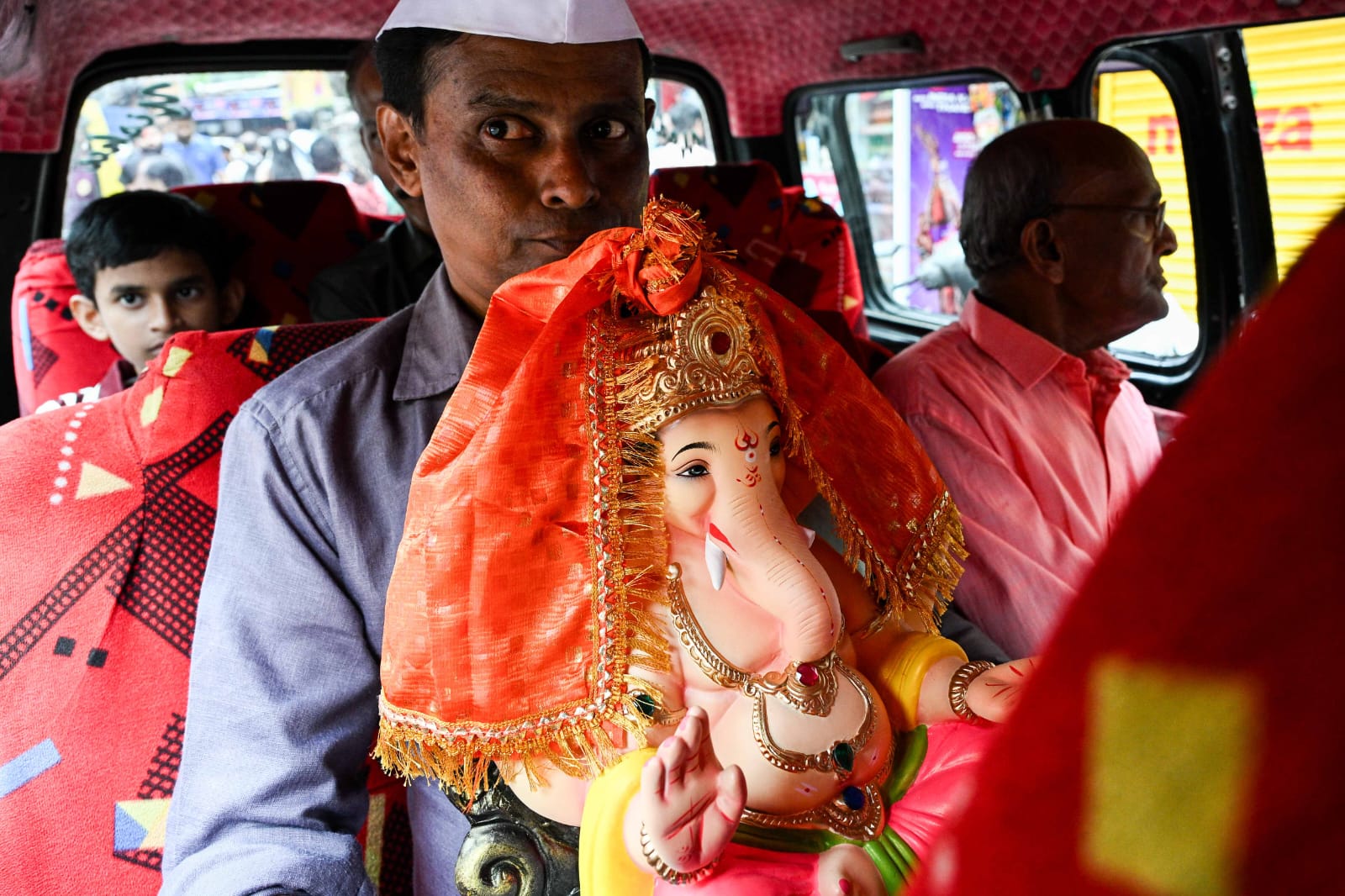 People carry Ganesh idols to their respective homes on the occasion of Ganesh Chaturthi festival, at Lalbaug