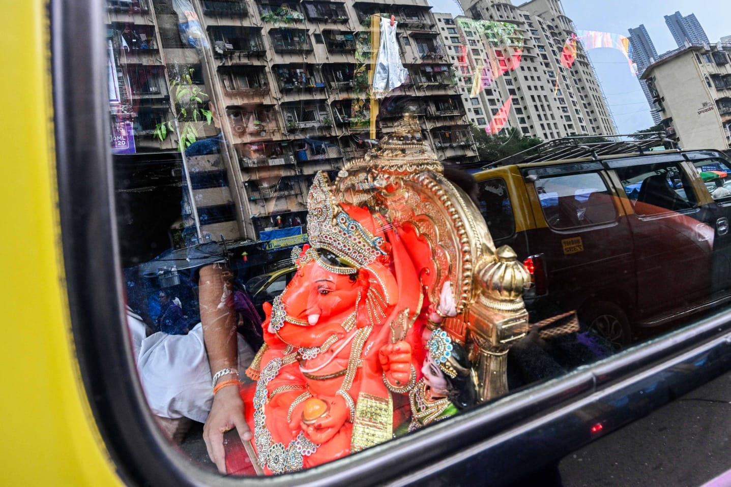 People carry Ganesh idols to their respective homes on the occasion of Ganesh Chaturthi festival, at Lalbaug