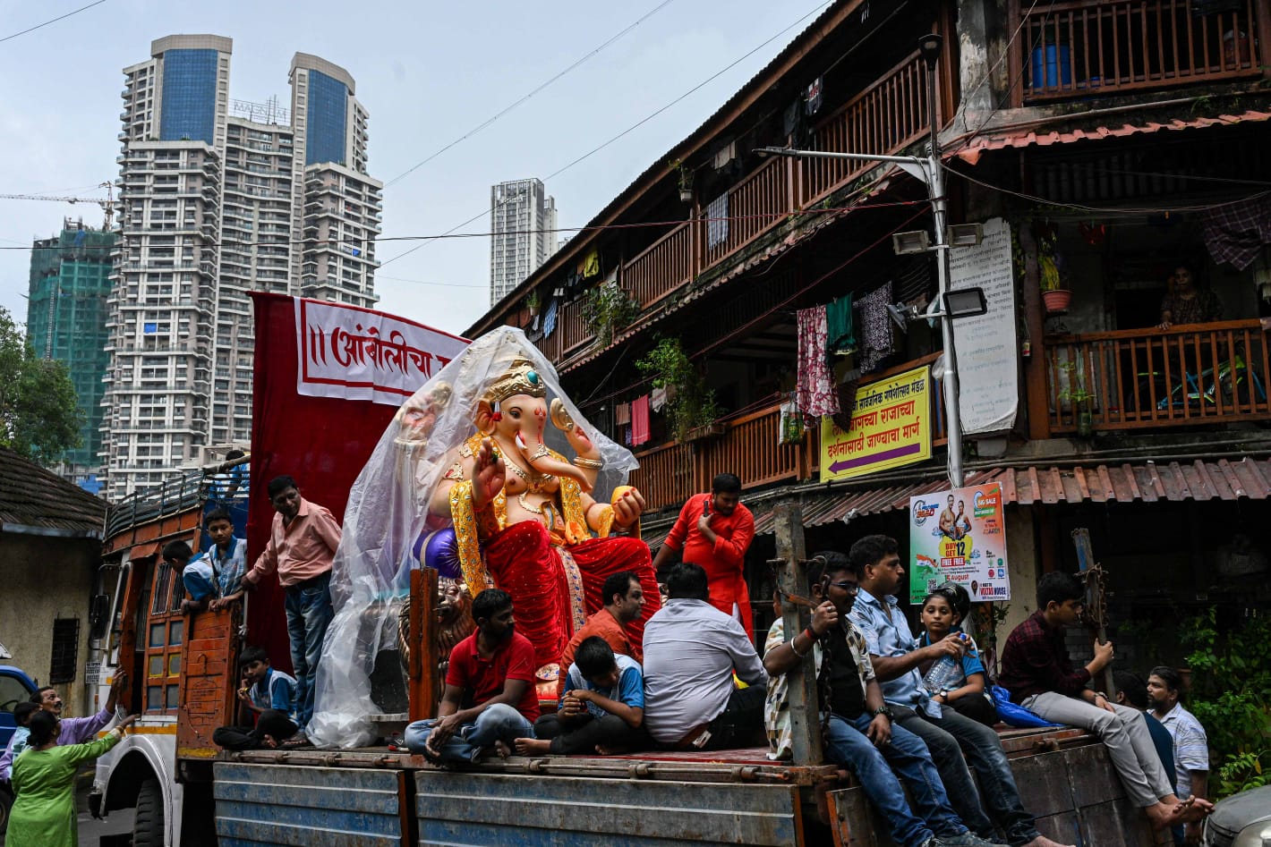 People carry Ganesh idols to their respective homes on the occasion of Ganesh Chaturthi festival, at Lalbaug