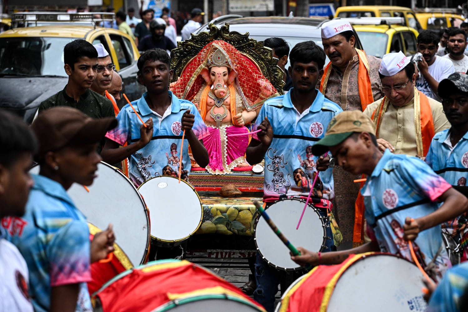 People carry Ganesh idols to their respective homes on the occasion of Ganesh Chaturthi festival, at Lalbaug