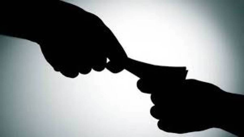 Anti Corruption Department caught Vijay Gawli a city survey clerk at the Kalvan Land Records Office while accepting a bribe