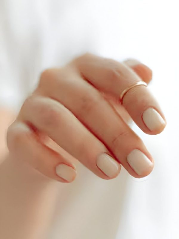 What are white or pale colored nails a sign of