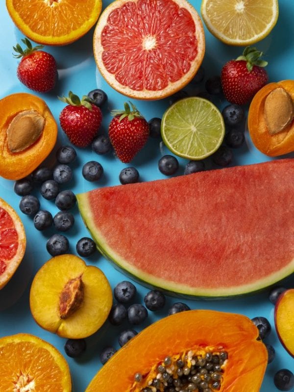 cropped-top-view-tasty-fruits-blue-background.jpg