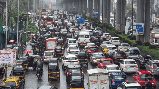 Heavy rainfall, flooded roads, and traffic chaos bring the city to a standstill | In Pictures 