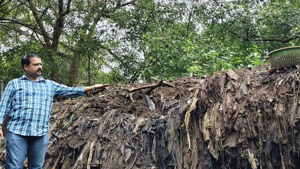 Sludge heaps of garbage next to drain in thane