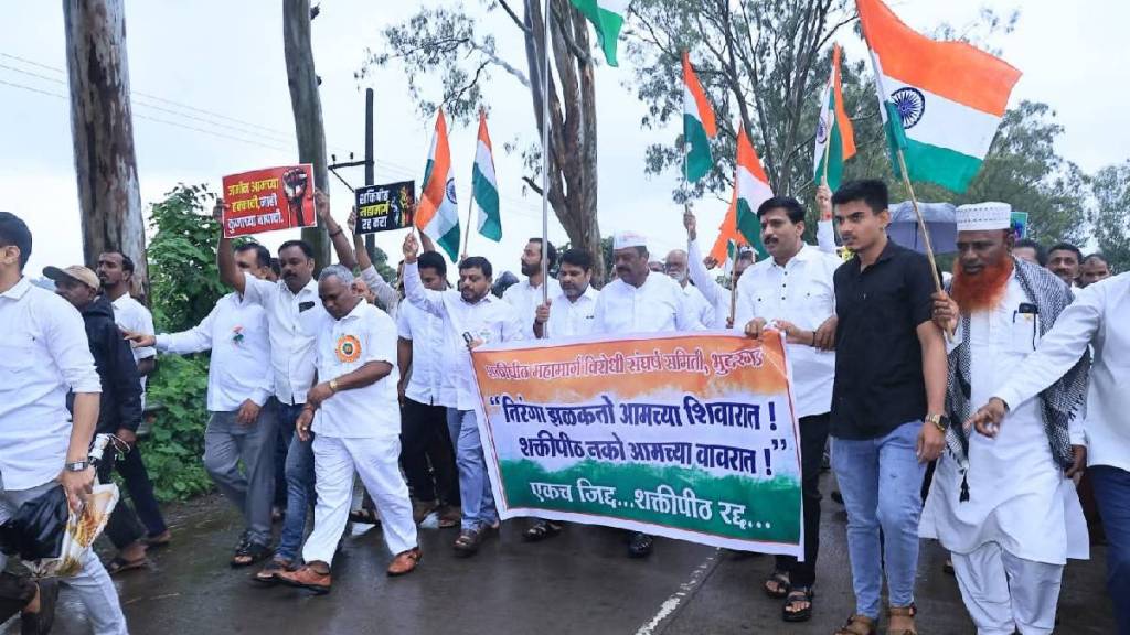 flag hoisted in the field against Shaktipeeth in kolhapur