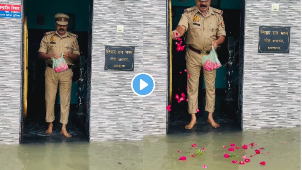 police offers milk and flowers to floodwater entering his home in prayagraj UP video goes viral marathi new