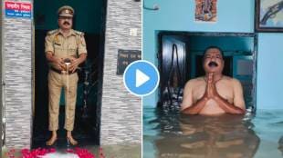 prayagraj cop performs ritual to ganga floodwater video