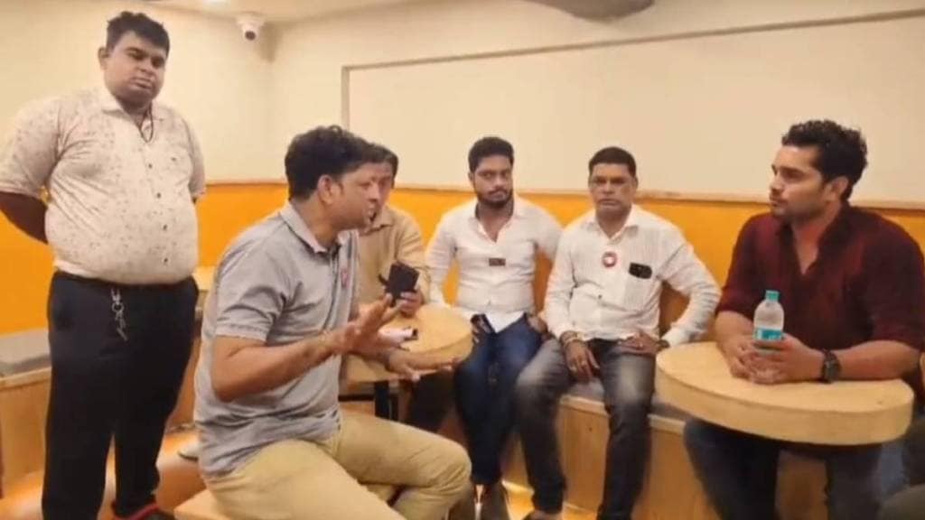 MNS office bearers Arun Jambhale, Harish Patil and others interacting with the cafe owner