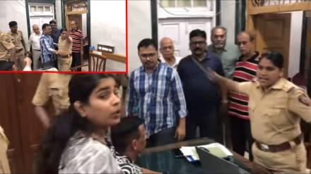 Police throws nameplate at young woman