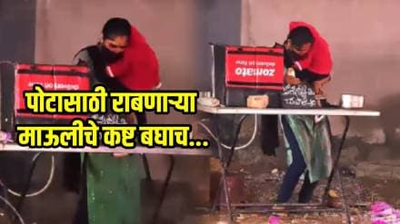 Woman Balances Roti Making on Cart While Caring for Child at Stall