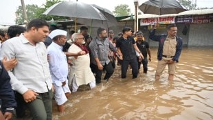 nashik chhagan bhujbal on ground steps into flood water to help victims