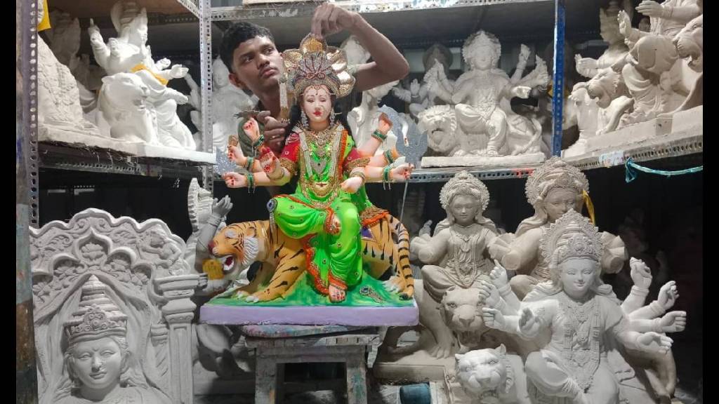 Idol makers are seen busy making idols of the goddess in factories