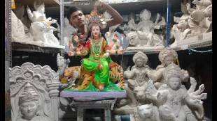 Idol makers are seen busy making idols of the goddess in factories