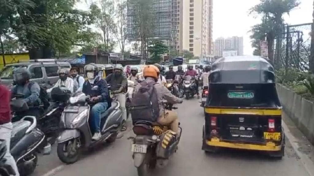 Vehicles running in the opposite lane on Kalyan Shilphata Road.