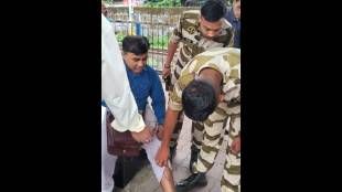 Railway commandos questioning a passenger who slipped while boarding a local train