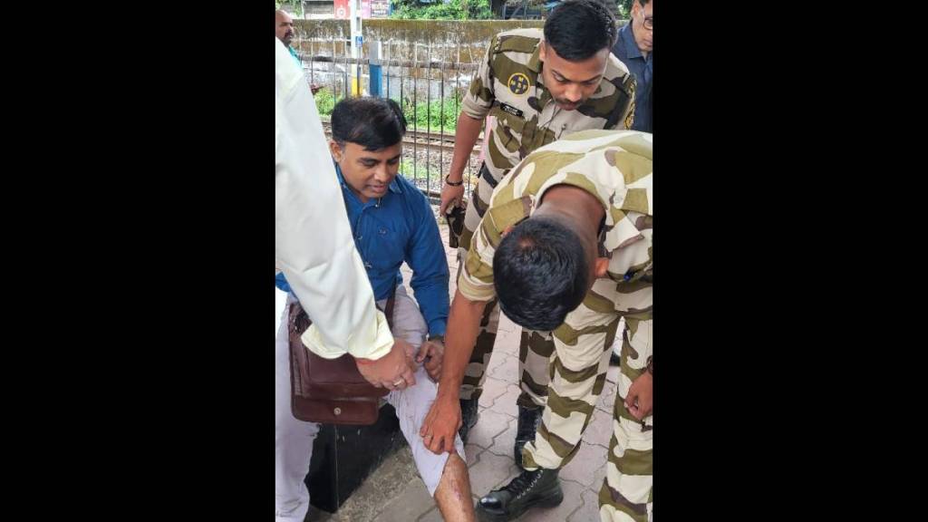 Railway commandos questioning a passenger who slipped while boarding a local train Railway commandos questioning a passenger who slipped while boarding a local train